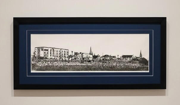 Framed print featuring original artwork of the Two Rivers Wisconsin skyline by PK for FISHSTKS.